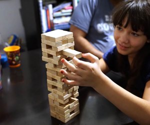 Pull out a block, place it on top but don't let the tower fall in the fun and challenging Jenga. 
